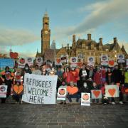 People gather to protest the Government's Nationality and Borders Bill in Bradford's City Park in 2021