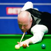 John Higgins in action during last year's World Snooker Championship at The Crucible Theatre in Sheffield.