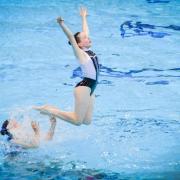Lily Priestley jumps into action for the team at  Bradford Artistic Swimming in a competition last year