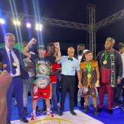 Tasif Khan (red shorts) celebrates becoming WBC Silver Super Flyweight champion