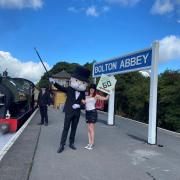 Mr Monopoly and day tripper Heather Griffin at Bolton Abbey Station