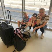 Rory Dollard's wife Joanne and their children Emily, 10, and Arthur, eight at Bergerac Dordogne Perigord Airport on August 28. Picture: PA