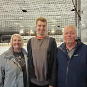 Josh Richardson (middle) with his parents