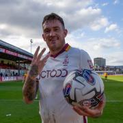 Andy Cook with the match ball after his hat-trick at Newport