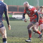 Dalton Desmond Walker (centre) in action for Keighley Cougars back in 2020.