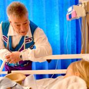 Billy Pearce meets a patient on the children's ward at Bradford Royal Infirmary