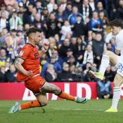 Dan James grabs Leeds' vital second goal against Millwall yesterday, with the win sending the hosts top of the Championship table.