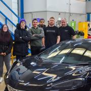 Bradford College students with the McLaren supercar. Pics: Bradford College