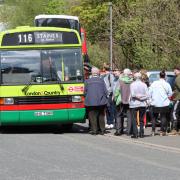 Visitors board a bus at the open day for a town tour