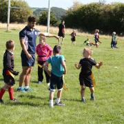 Yorkshire Carnegie first-team winger Dan Tai, who is a former pupil at Prince Henry's Grammar School, coaches Baildon under-sevens at their junior and mini registration day at Jenny Lane