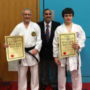 BLACK BELTS: Paul Ellen and Rory Gallagher with Mo Ilyas