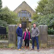 From left, Colin and Emma Clewes with Restoration Man presenter George Clarke outside the old church building in Oxenhope