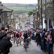 Riders scale the iconic Main Street in Haworth during a previous year's Tour de Yorkshire..