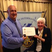 Steve Seymour receives the Paul Harris Fellowship from Keighley Rotary Club president Marie Hickman