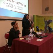 Bradford West candidates Naz Shah, left and Salma Yaqoob, right, with meeting chairman Selina Ullah