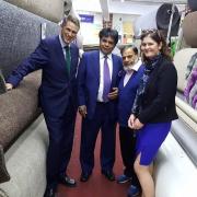 Chief whip Gavin Williamson, left, and Conservative candidate for Bradford South Tanya Graham meet businessmen at Ali Baba Carpets in Great Horton