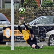 Steeton goalkeeper Joe Mash saves a first-half penalty against Lower Hopton Picture: John Chapman