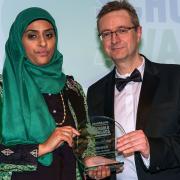 RESPECTED: Ozuma Hussain receives the Voluntary Contribution Award from T&A editor Nigel Burton