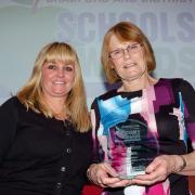 Anne Seddon of Saville AV with winner of the Supporting Staff Member Award, Janet Thomas of Canterbury Nursery School, at the 2018 T&A Bradford & District Schools Awards.