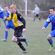 Wibsey's Jamie Brennan (black and yellow) scored in his side's 2-0 Premier Division win over Stanningley Old Boys Picture: Tom Smith
