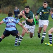 Ben Brown (green) was great behind the boot for Old Grovians against Wetherby