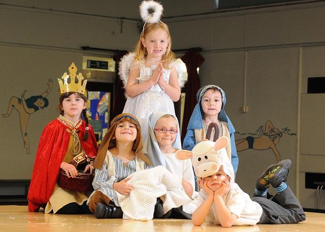 Ellie Gill as the King, Alexander Robinson as the Angel, Zac Moon as Joseph and Isobella Swales as Mary, shepherd Harvey Pearson and Alfie Spencer as the lamb in the Nativity at Shibden Head Primary, Queensbury