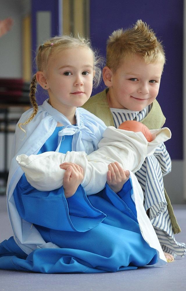 Kelsie Levitt as Mary and Liam Harvey as Joseph with the Baby Jesus in the Nativity at Carrwood Primary School, Holme Wood