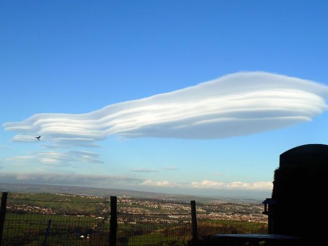Readers' pictures of the lenticular cloud formations across Bradford on Thursday. Picture taken from Queensbury by Darren Moon