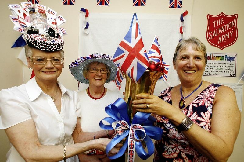 Decorated hats judge Jennifer Linton, right, joins winners Jackie Granger, left, and Jean Tunney at the Keighley Salvation Army Diamond Jubilee party