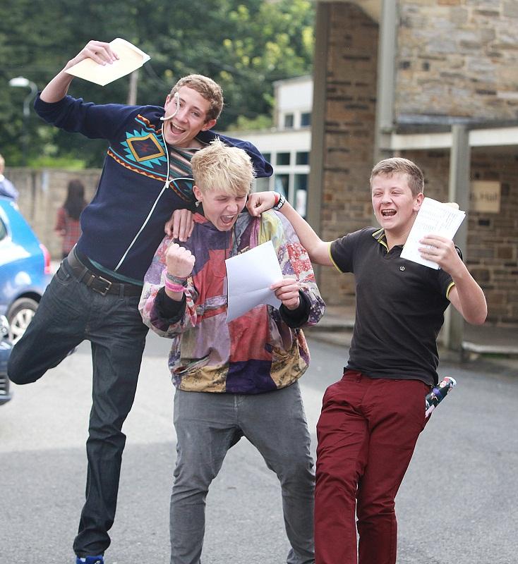 Pupils collect their GCSE results at Aireville School, Skipton - Albert Hewetson, and Jack Andrews jump on friend Sam Ridding