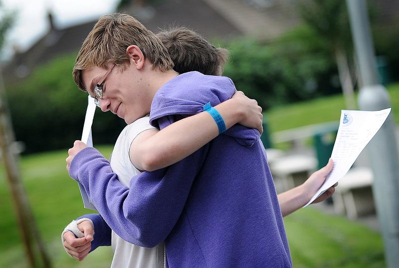 Jack Roper is congratulated by Samuel Scott on GCSE results day at Titus Salt School