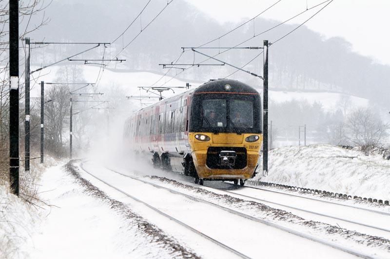 Train services, such as this one between Keighley and Steeton, kept running despite heavy snowfall