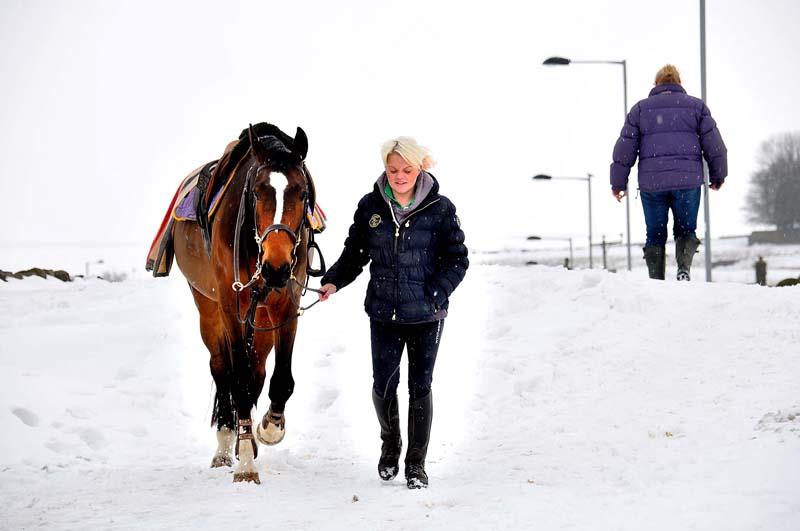 Sam Lambert with her horse Max braving the deep snow on Shay Lane, Wilsden