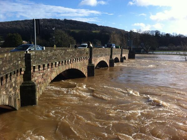 Raging waters flow under the Wye bridge in Monmouth 