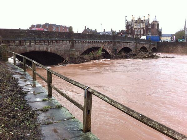 Raging waters flow under the Wye Bridge, Monmouth