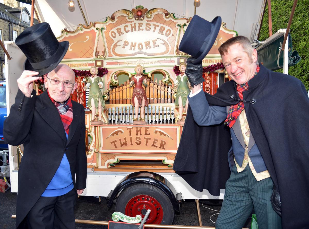 Denis Dibb and Nigel Wilkinson with their street organ at the Dickensian Market