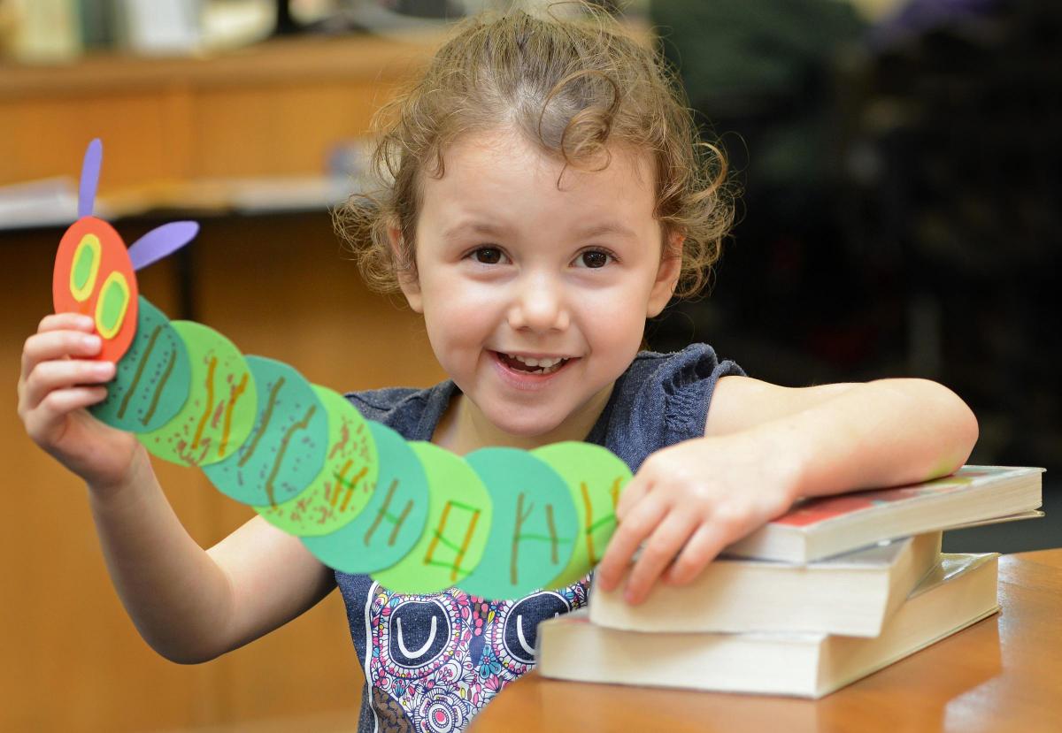 Sofia Rushworth with a Hungry Caterpillar bookmark she made at Wibsey Library for World Book Day