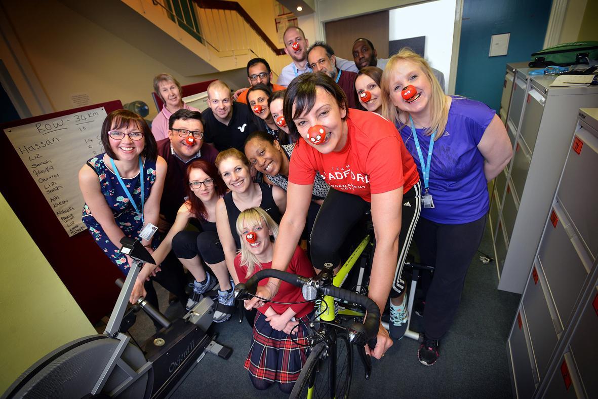 Bradford University admissions team hold a rowing and cycling challenge to raise money for Comic Relief.  Foreground on the bike is Dida Chahal