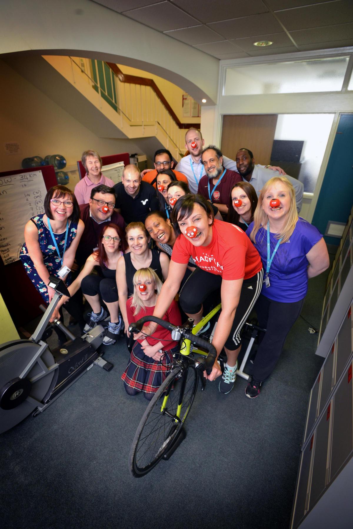 Bradford University admissions team hold a rowing and cycling challenge to raise money for Comic Relief.  Foreground on the bike is Dida Chahal