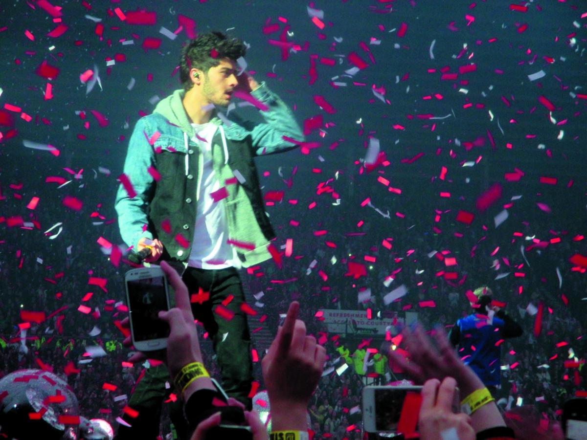 Zayn Malik on stage with One Direction in Sunderland in 2014