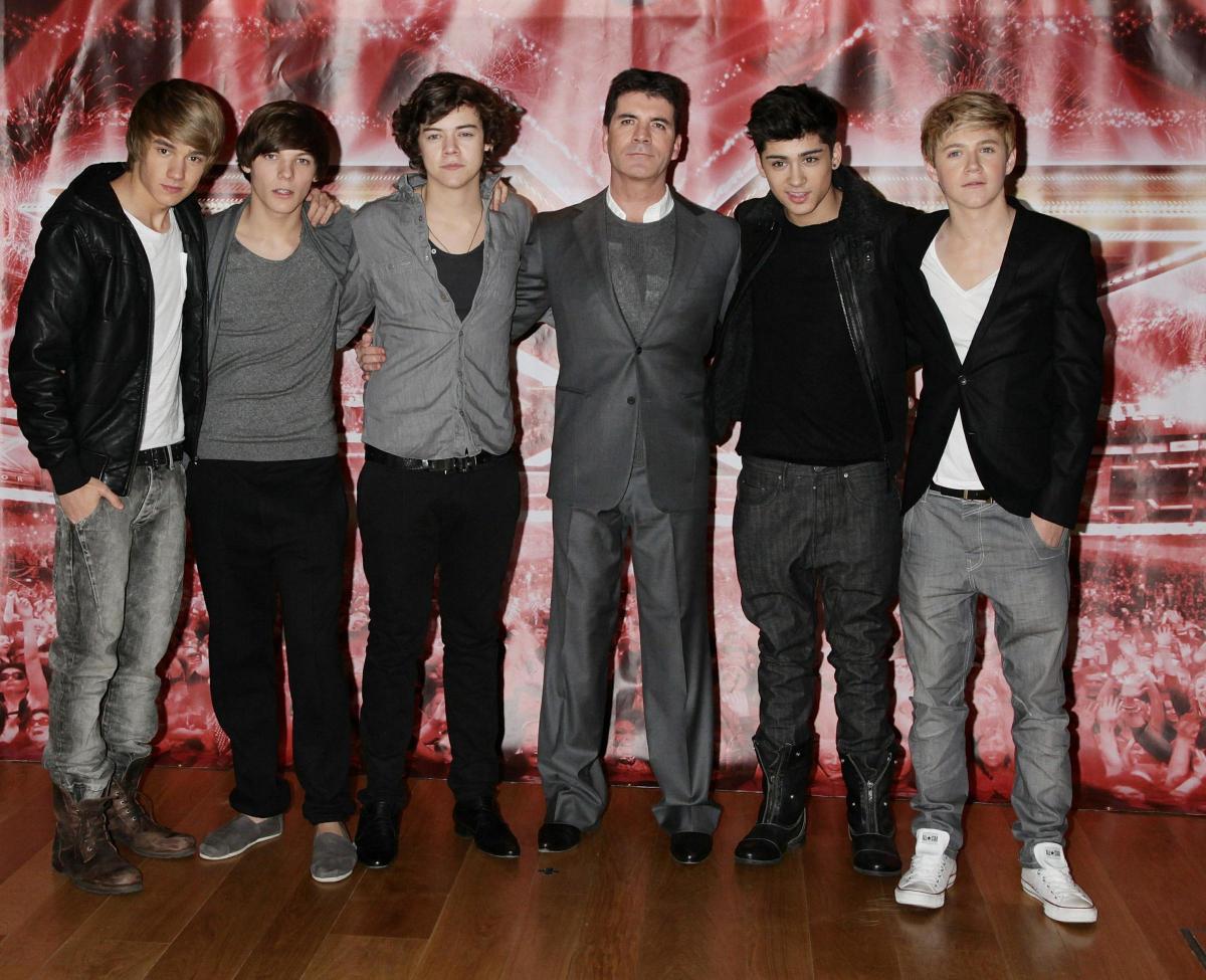 Simon Cowell with One Direction (from left) Liam Payne, Louis Tomlinson, Harry Styles, Zayn Malik and Niall Horan attending a press conference for The X Factor in 2010