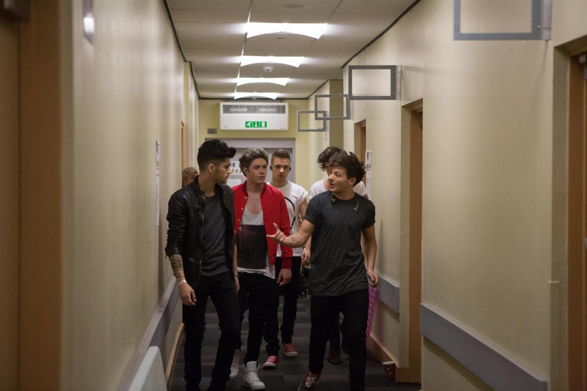 Zayn (left) with his One Direction bandmates Liam Payne, Harry Styles, Niall Horan and Louis Tomlinson in their film This Is Us in 2013