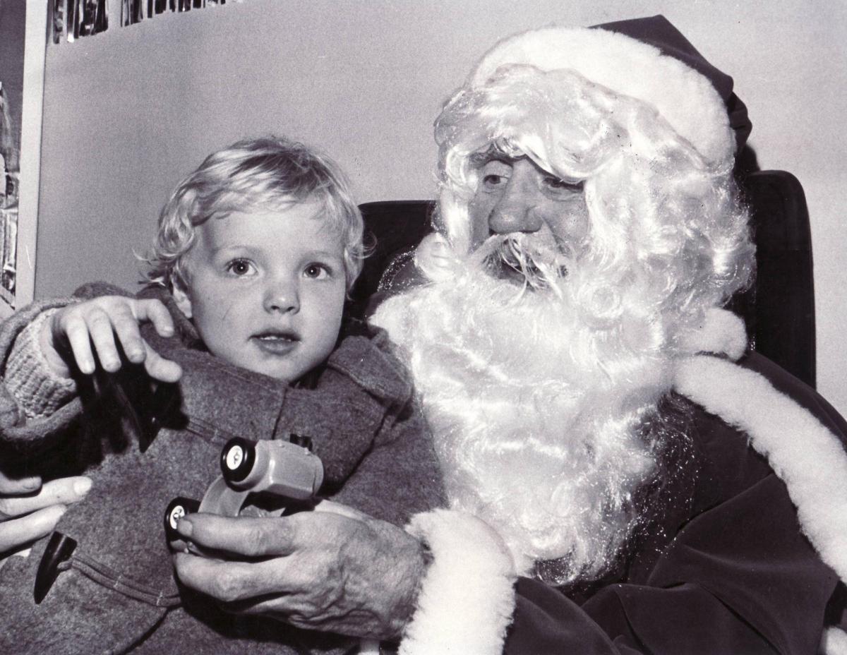 A lovely Christmas picture from 1979 - do you know who the child is?
