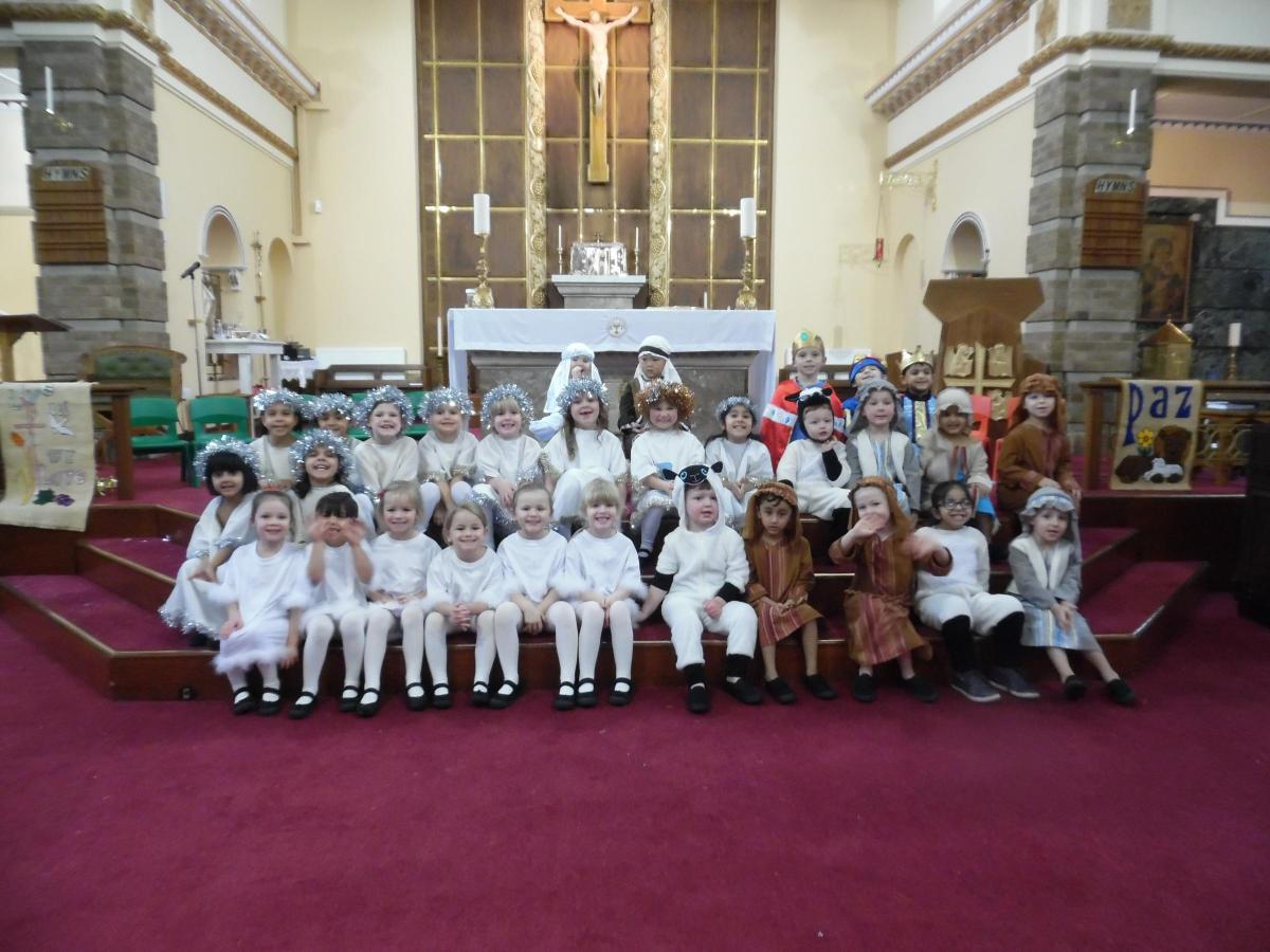 St. Clare's Catholic Primary School's performance of 'Whoops-a-Daisy Angel' Reception class told the story and Year 1 and Year 2 sang and narrated.