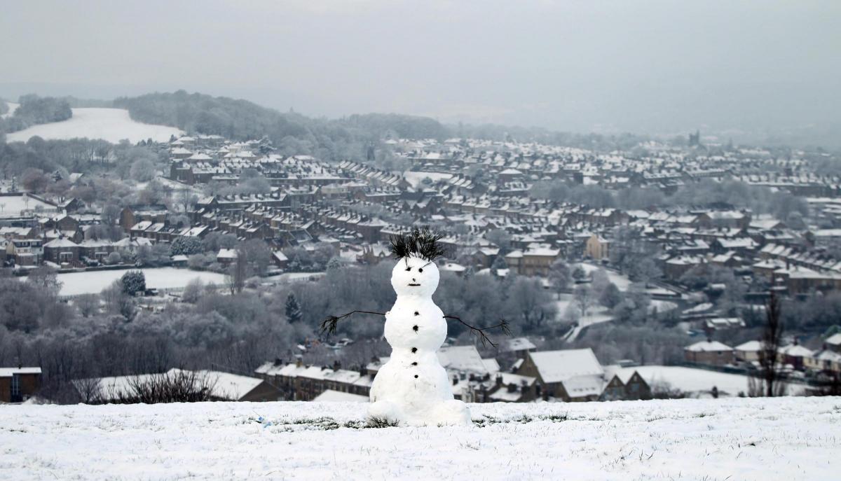 The first snowmen of 2016 appear...This one with panoramic views over Bradford  become an instant tourist attraction. Picture: Nigel Bennett