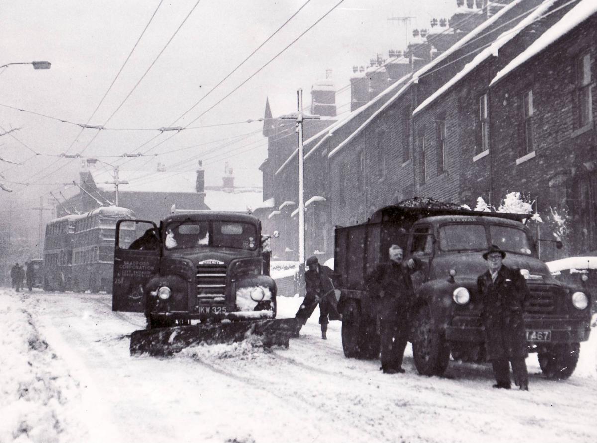 Trucks in a snowy Clayton in 1958