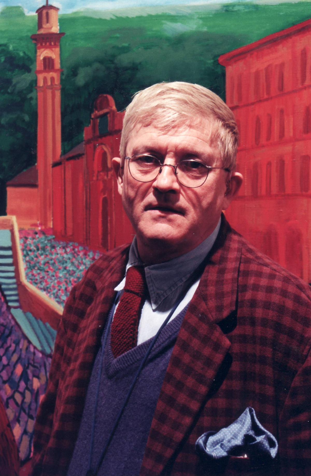 Hockney with a piece of his work in 1997