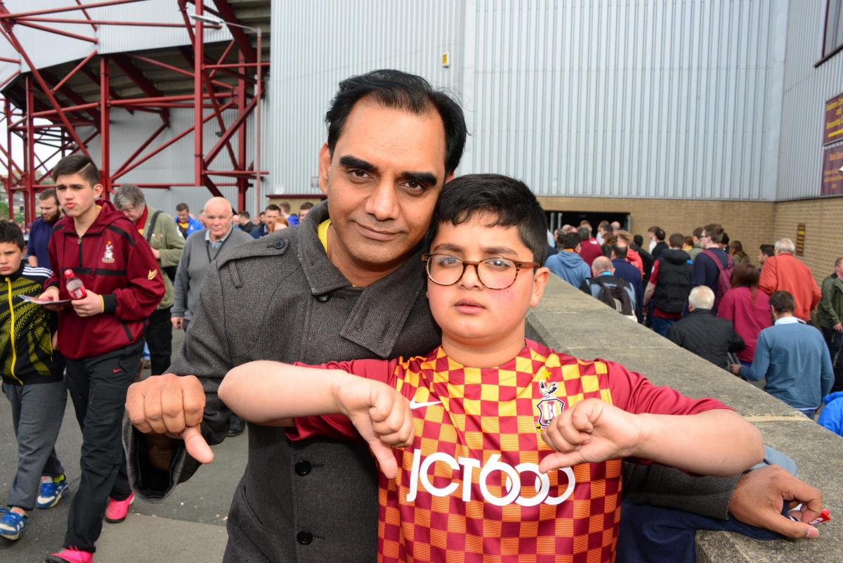 Despondent City fan. Councillor Mohammed Shafiq with his son Uziar, as fans drift away from Valley Parade after today's defeat to Millwall