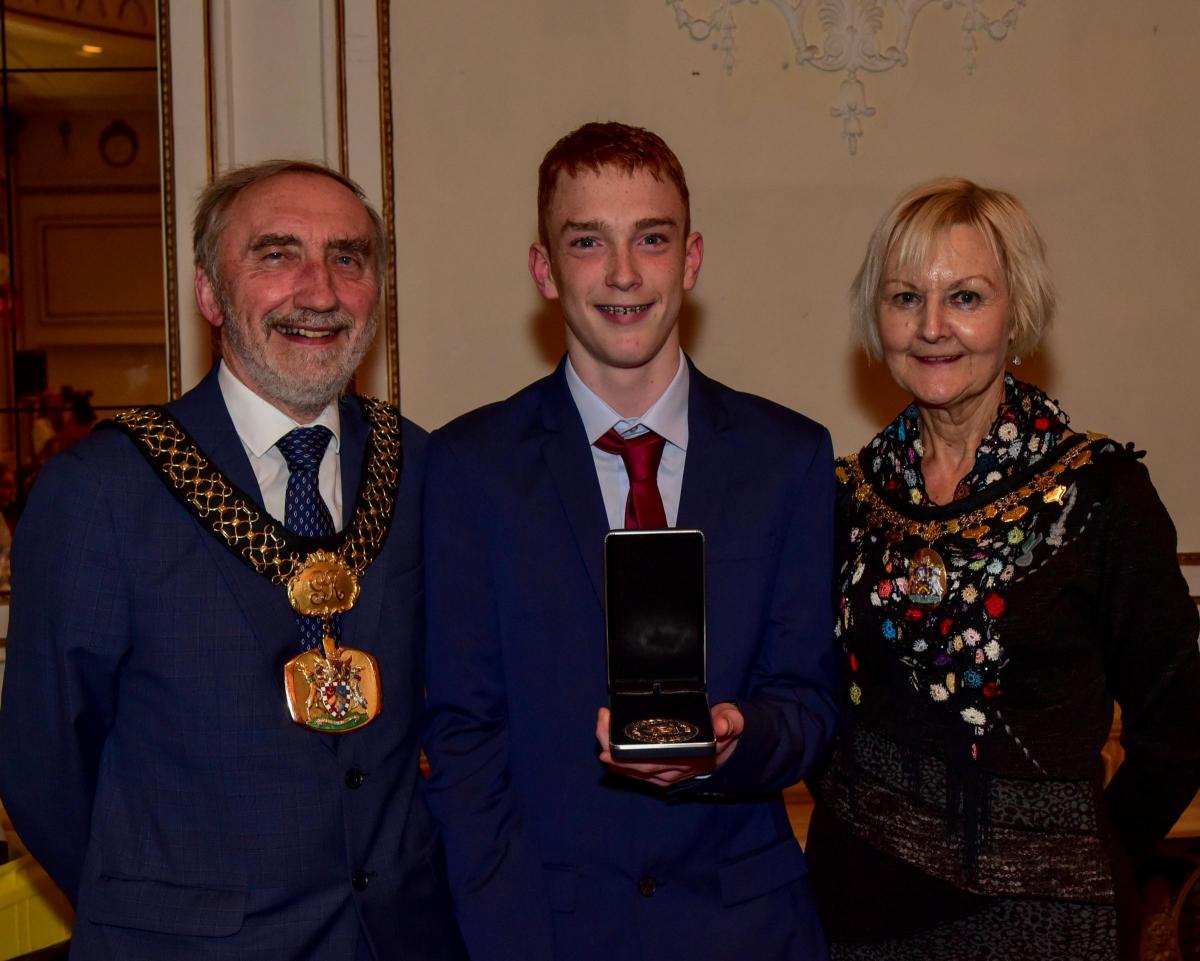Fundraiser award winner Joshua Capper with Lord Mayor Geoff Reid and Lady Mayoress Chris Reid