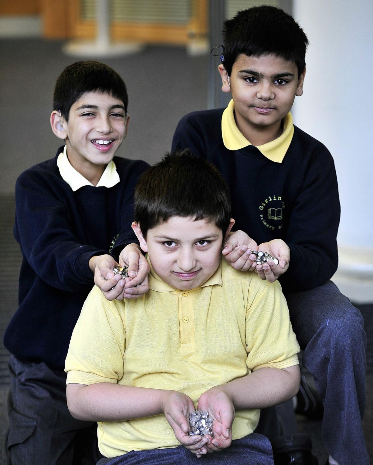 Mohammed Suffiyan, Sohail Ahmed and Adib Syed with some of the batteries they helped to collect for recycling